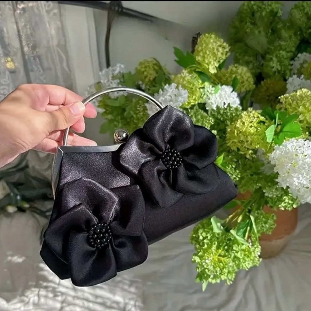 Elegant Black Handbag with Floral Accents